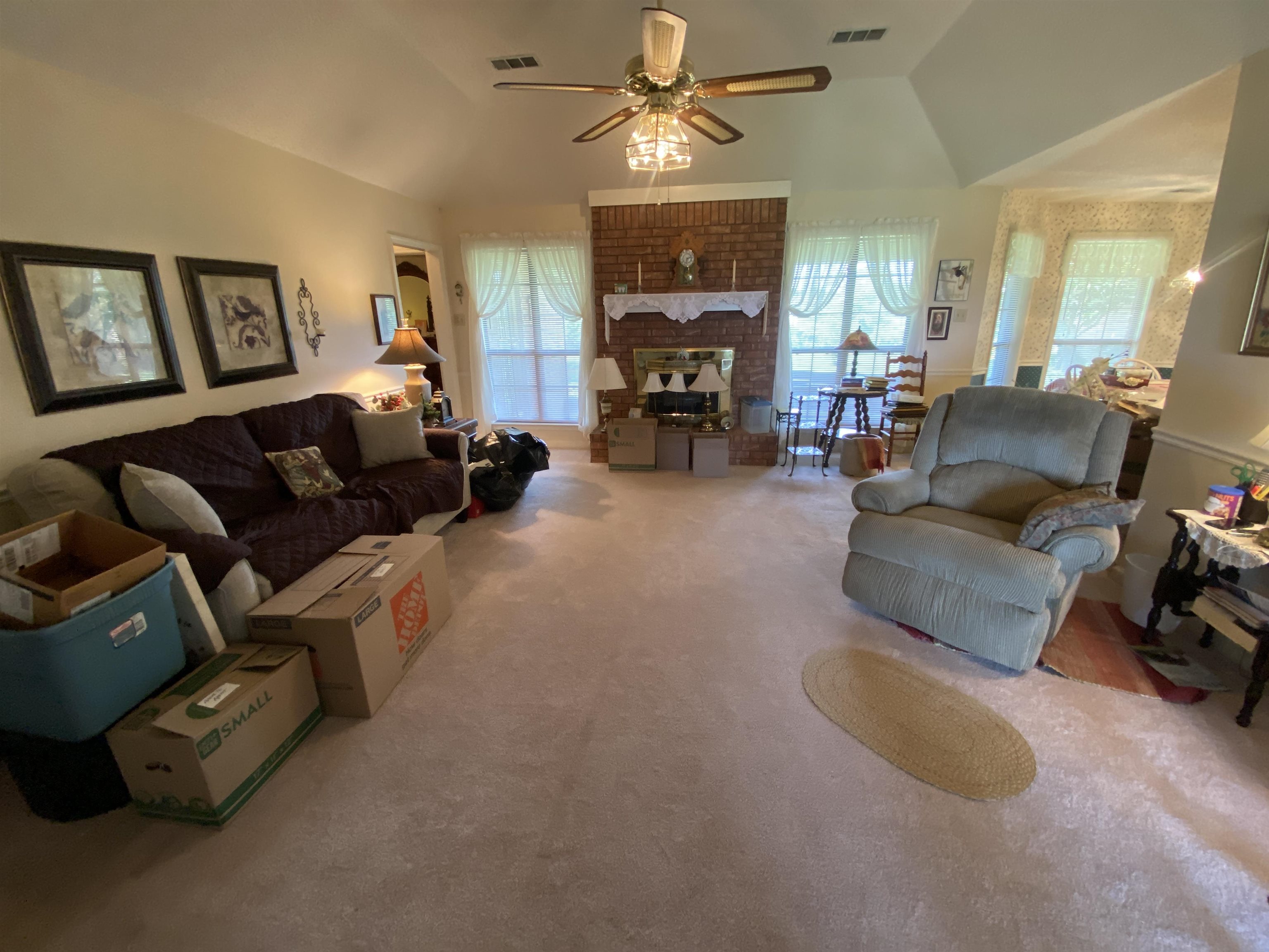 240 Sawmill Road Brighton, TN 38011 - Photo 13 of 25 Living area featuring lofted ceiling, plenty of natural light, carpet floors, ceiling fan, and a fireplace