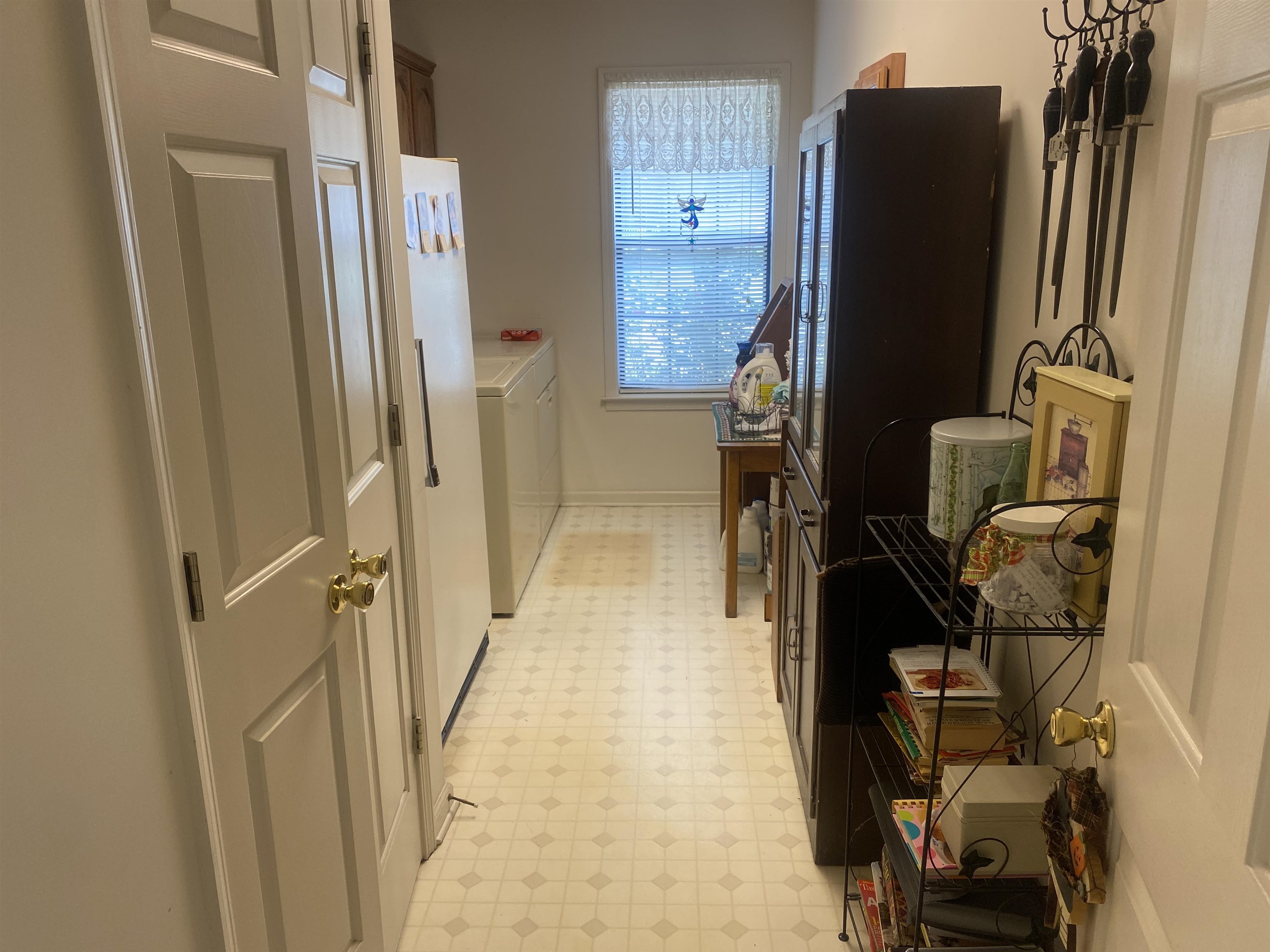 240 Sawmill Road Brighton, TN 38011 - Photo 20 of 25 Washroom with light floors, baseboards, and washer / dryer