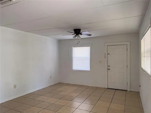 a view of an empty room and window