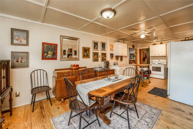 a kitchen with refrigerator and cabinets