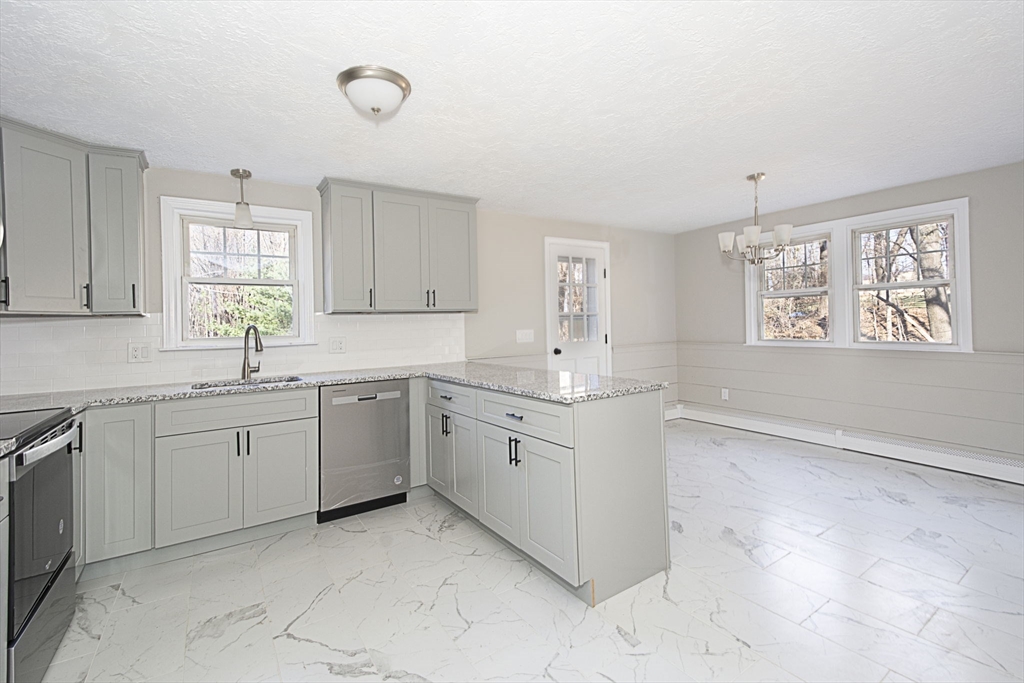 55 Dodge Road Sutton, MA 01590 - Photo 11 of 35 a kitchen with sink cabinets and window