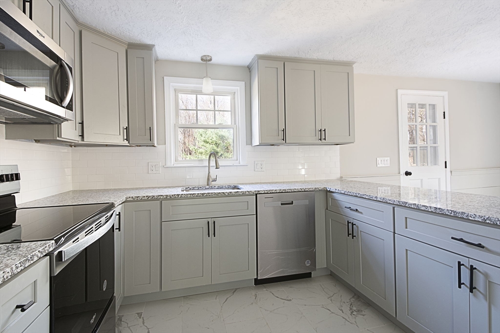 55 Dodge Road Sutton, MA 01590 - Photo 12 of 35 a kitchen with sink cabinets and window