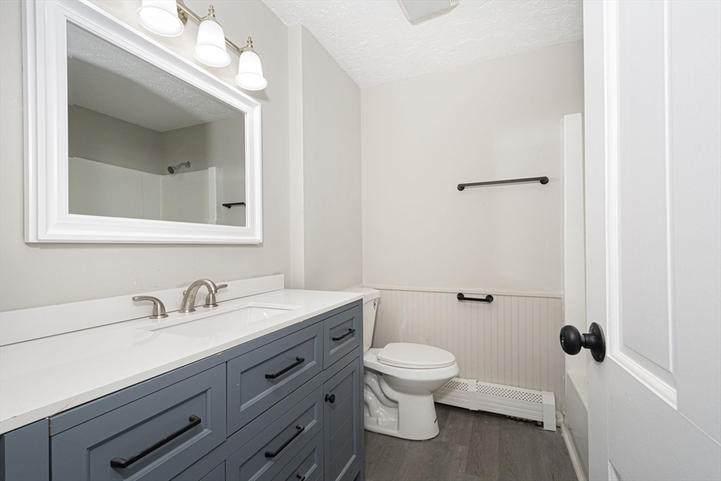55 Dodge Road Sutton, MA 01590 - Photo 15 of 35 a bathroom with a toilet sink and mirror
