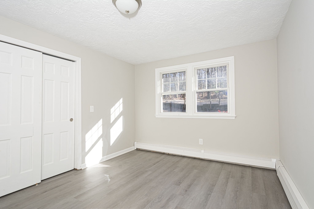 55 Dodge Road Sutton, MA 01590 - Photo 20 of 35 wooden floor in an empty room with a window