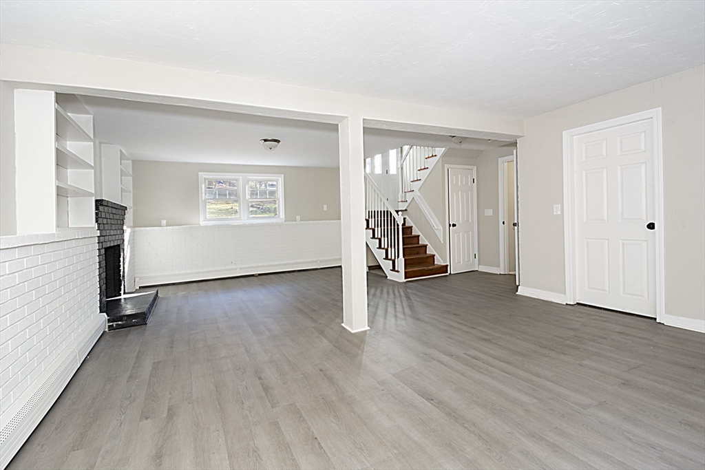 55 Dodge Road Sutton, MA 01590 - Photo 25 of 35 an empty room with wooden floor and a window