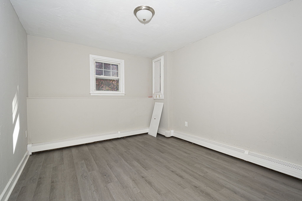 55 Dodge Road Sutton, MA 01590 - Photo 26 of 35 an empty room with wooden floor and windows