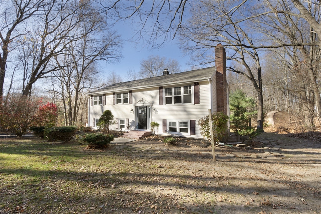 55 Dodge Road Sutton, MA 01590 - Photo 3 of 35 a view of a white house with a large tree in front of it