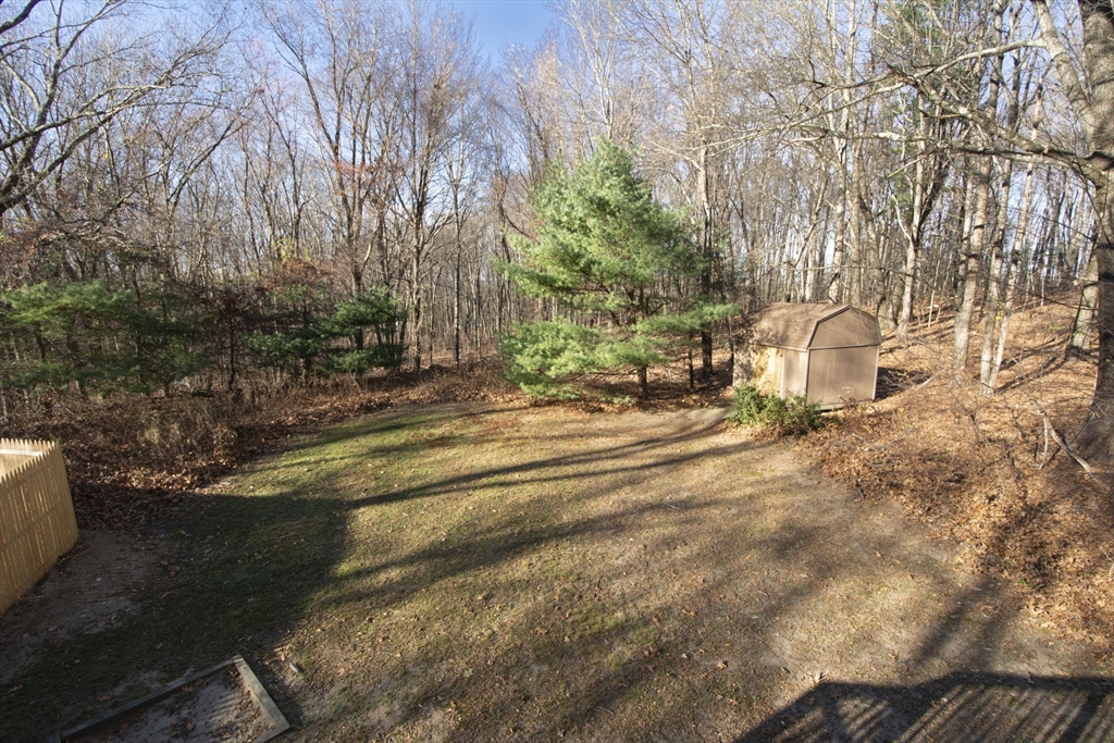 55 Dodge Road Sutton, MA 01590 - Photo 34 of 35 a backyard of a house with lots of green space