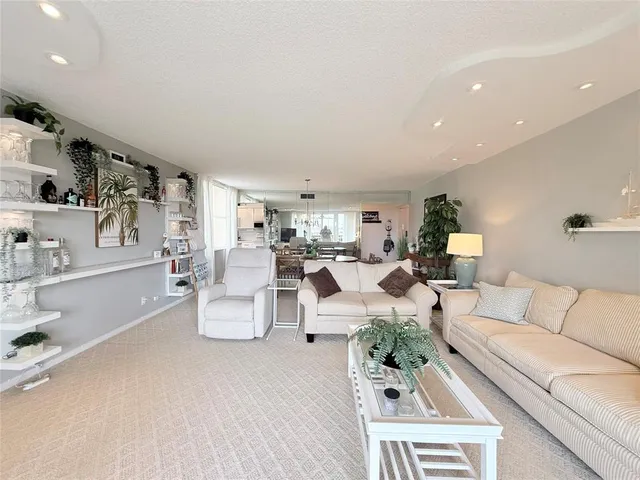 a living room with furniture and white walls