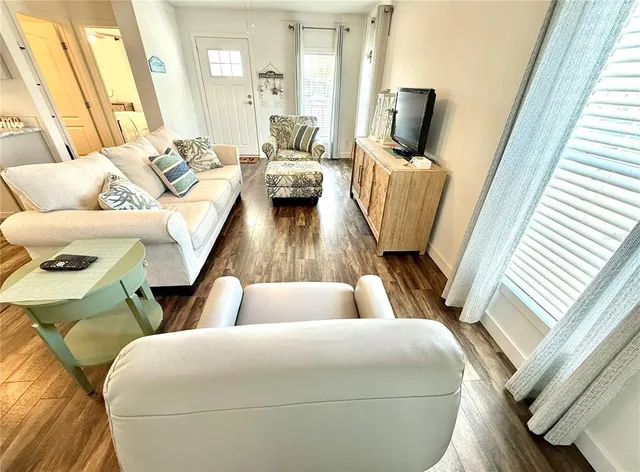 a living room with furniture and a table