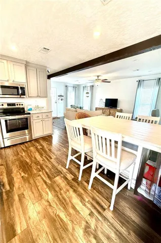 a bed sitting in a bedroom next to a window