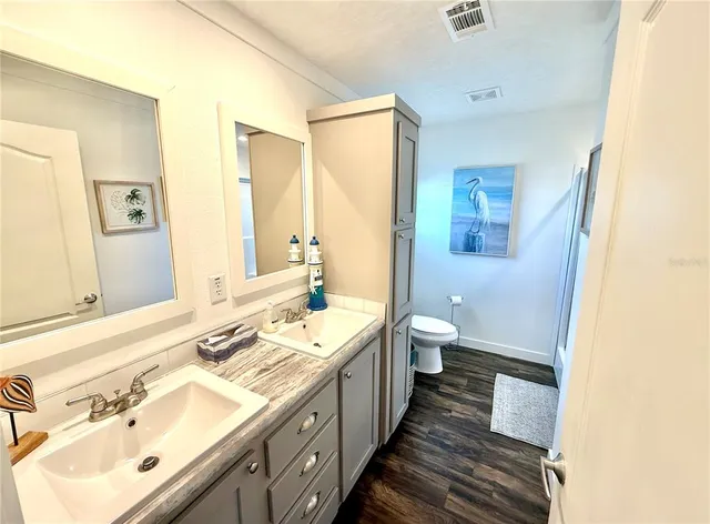 a view of front door with wooden floor