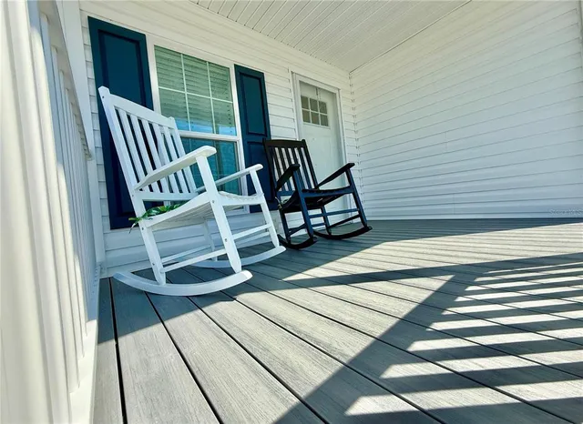 a view of a balcony with furniture