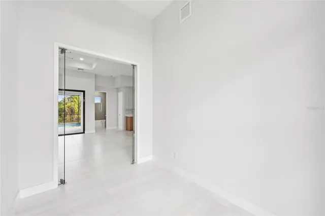 a view of an empty room with a window