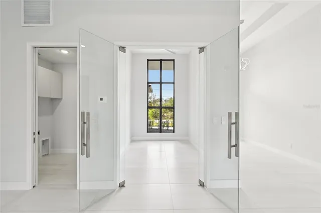 a bathroom with a granite countertop sink toilet and mirror