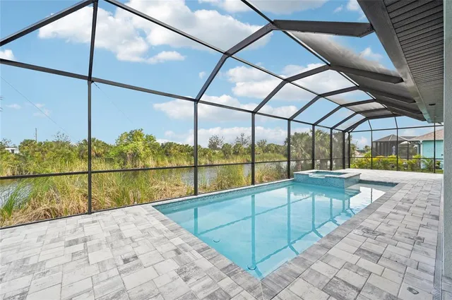 an aerial view of a house with a lake view