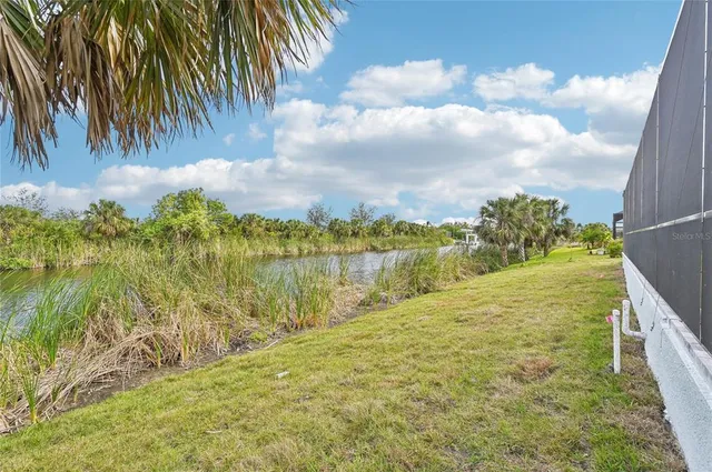 a view of a lake with boats and trees