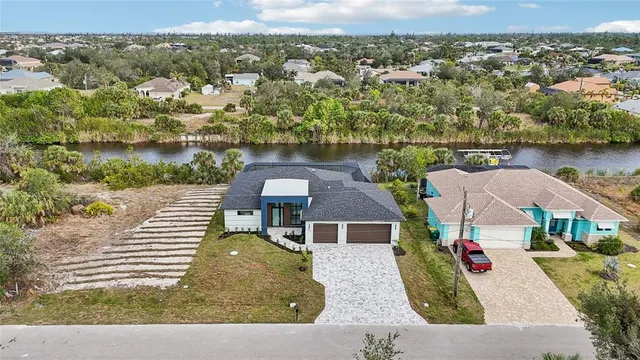 a view of a swimming pool with a table and chairs