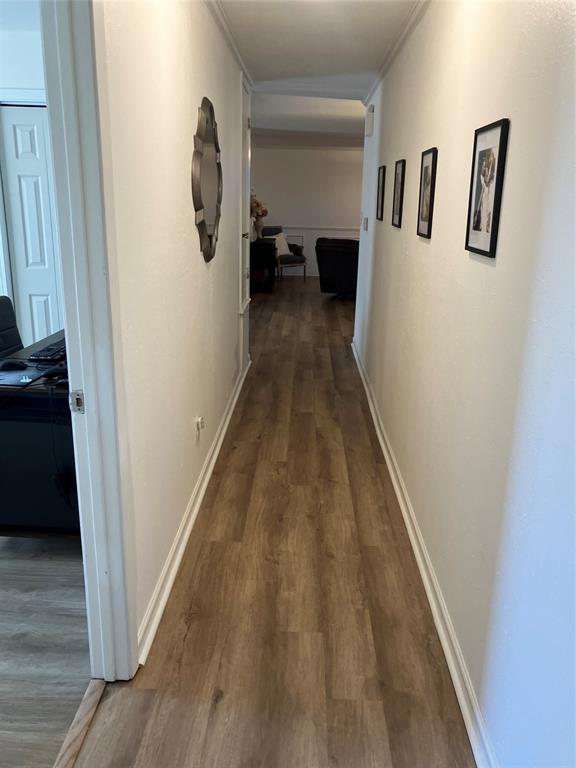 233 Church Road Stonewall, LA 71078 - Photo 20 of 32 Corridor with dark wood finished floors and crown molding