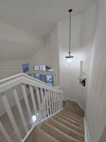 a view of bedroom with stairs