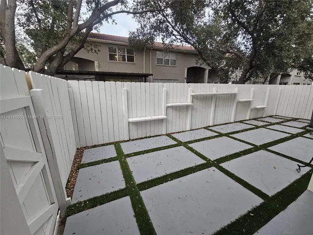 a front view of house with yard barbeque oven and outdoor seating