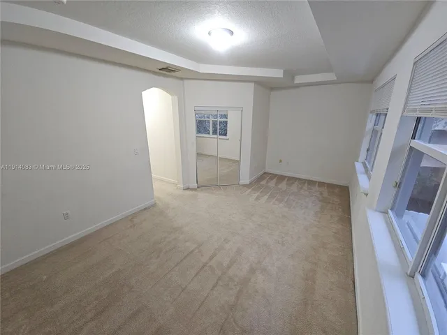 a bathroom with a shower sink vanity and mirror