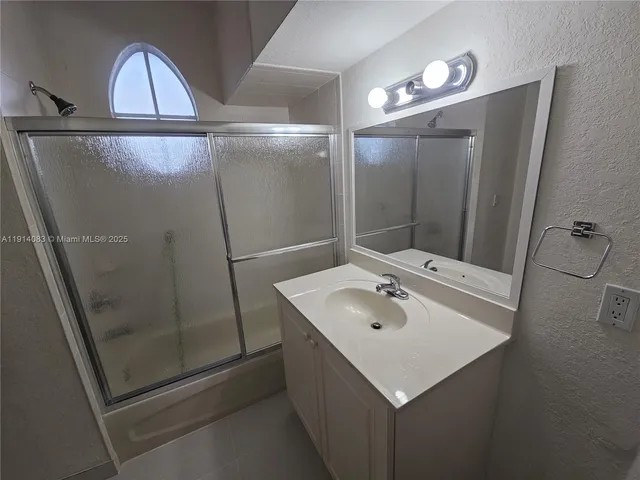 a view of a swimming pool with a table and chairs