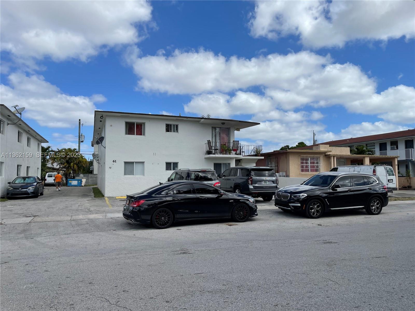61 West 13th Street Hialeah, FL 33010 - Photo 2 of 3 a car parked in front of a white house