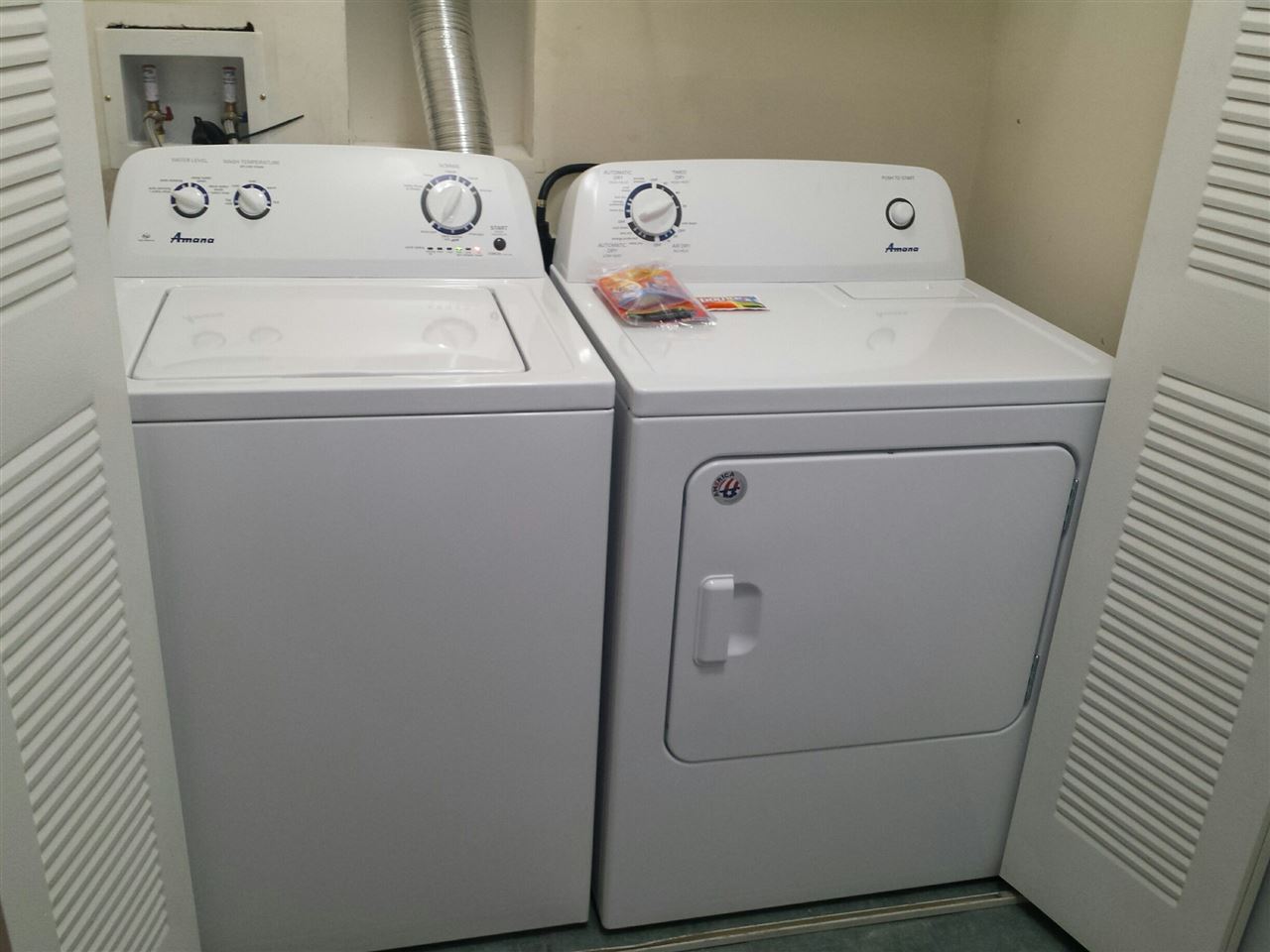 520 Florida Club Boulevard, Unit 103 St. Augustine, FL 32084 - Photo 13 of 26 a utility room with dryer and washer