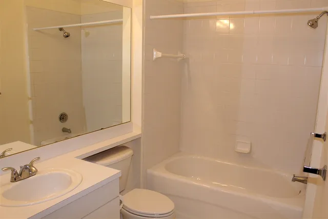 a view of a patio with a table chairs and a patio