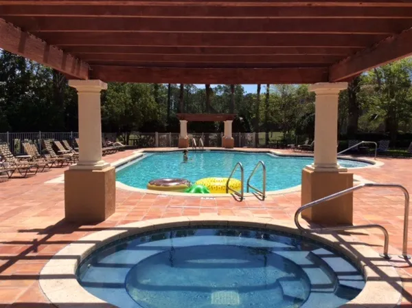 a view of a swimming pool and a garden
