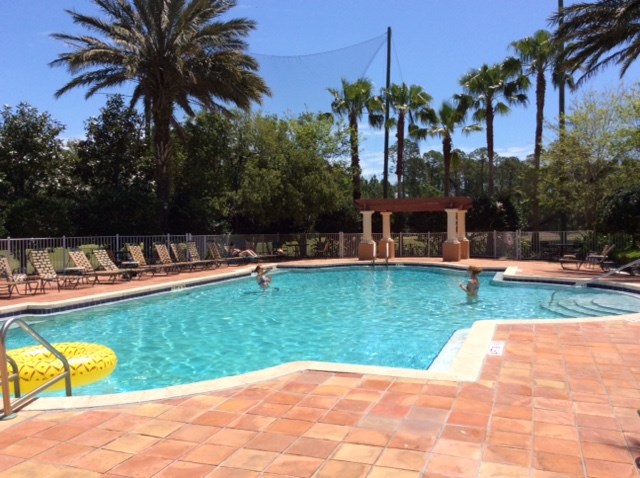 520 Florida Club Boulevard, Unit 103 St. Augustine, FL 32084 - Photo 22 of 26 a view of a swimming pool and a garden