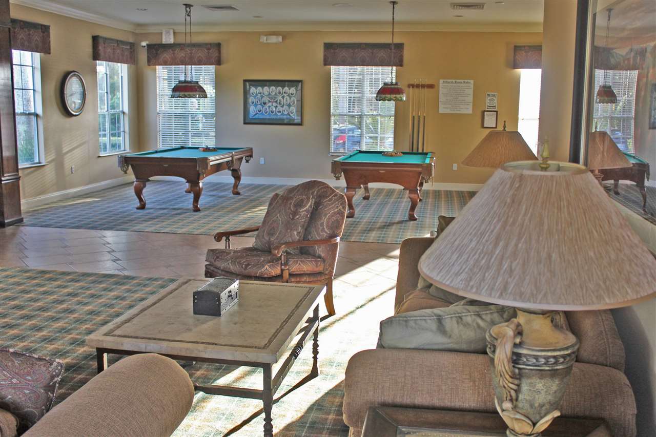 520 Florida Club Boulevard, Unit 103 St. Augustine, FL 32084 - Photo 24 of 26 a living room with furniture and window