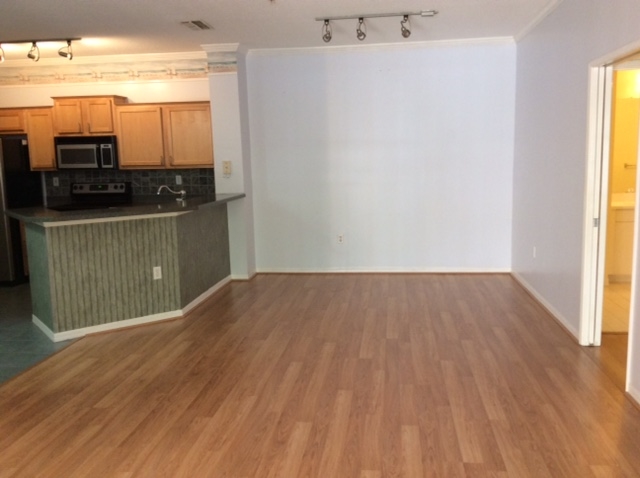 520 Florida Club Boulevard, Unit 103 St. Augustine, FL 32084 - Photo 8 of 26 a view of kitchen and wooden floor
