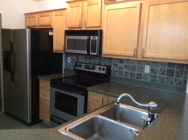 a kitchen with a sink and cabinets