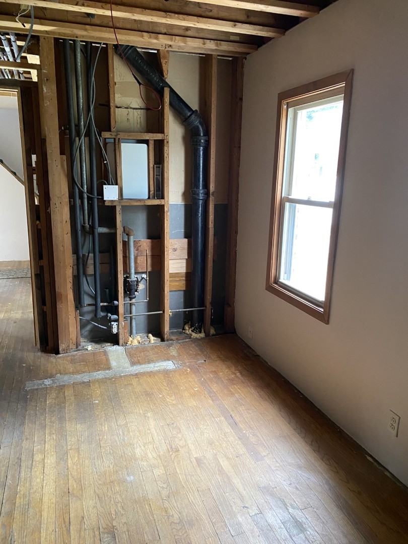 242 Highland Road Willowbrook, IL 60527 - Photo 18 of 24 a view of a house with wooden floor and a window
