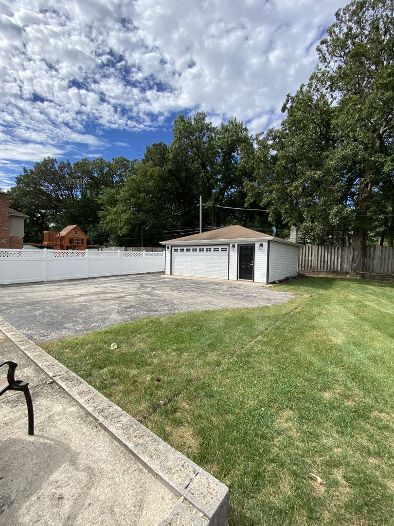 242 Highland Road Willowbrook, IL 60527 - Photo 4 of 24 a house view with a outdoor space