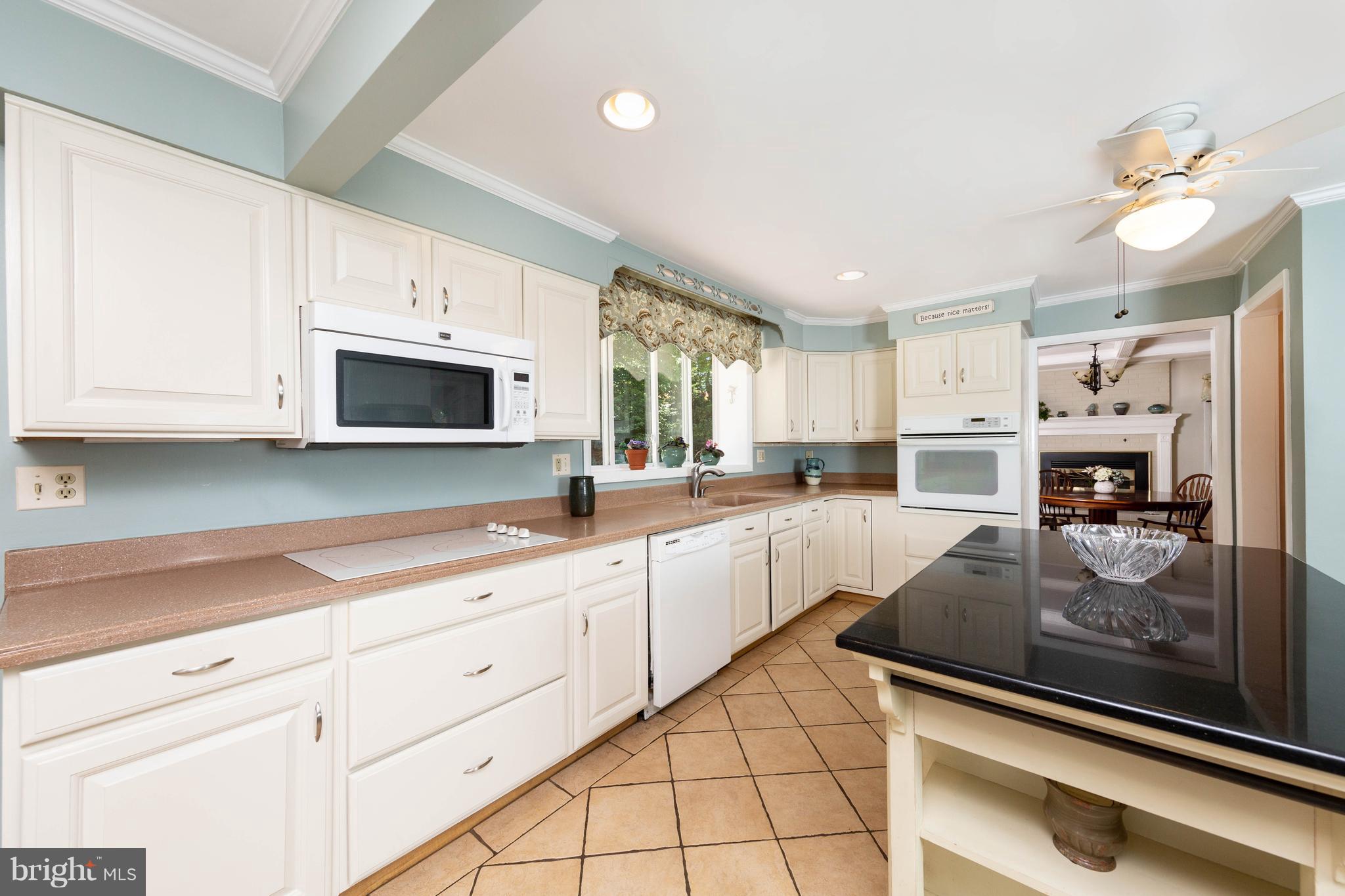 413 Whitaker Mill Road Fallston, MD 21047 - Photo 11 of 28 a kitchen with sink cabinets and microwave