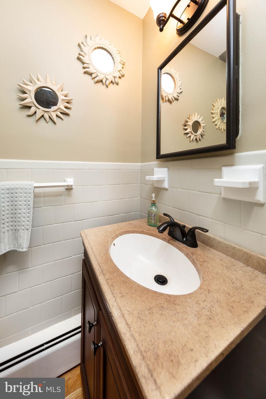 413 Whitaker Mill Road Fallston, MD 21047 - Photo 12 of 28 a bathroom with a sink and mirror