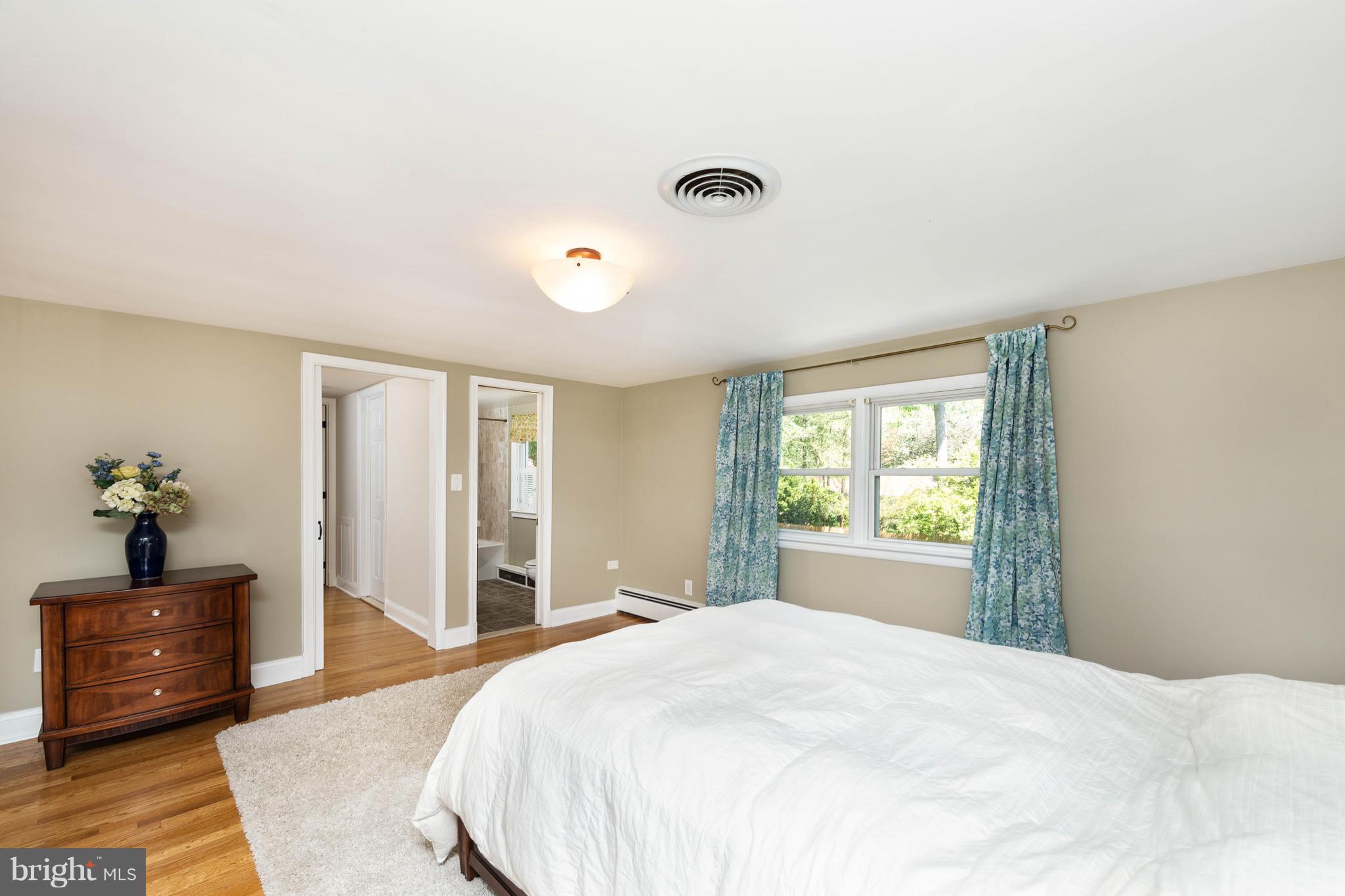 413 Whitaker Mill Road Fallston, MD 21047 - Photo 14 of 28 a bedroom with a bed and a large window