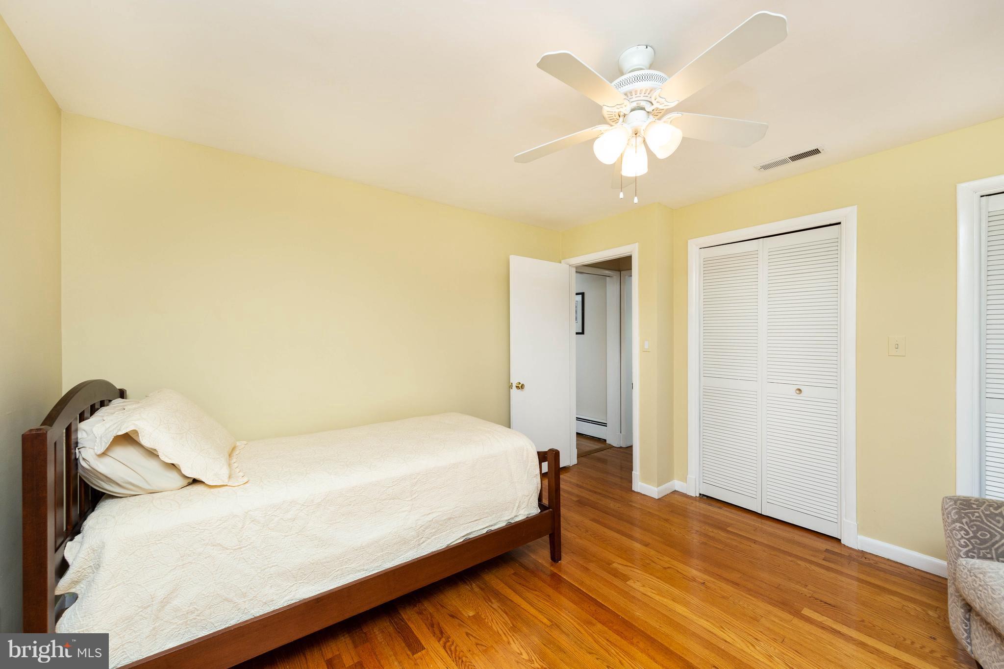 413 Whitaker Mill Road Fallston, MD 21047 - Photo 18 of 28 a bedroom with a bed and a ceiling fan