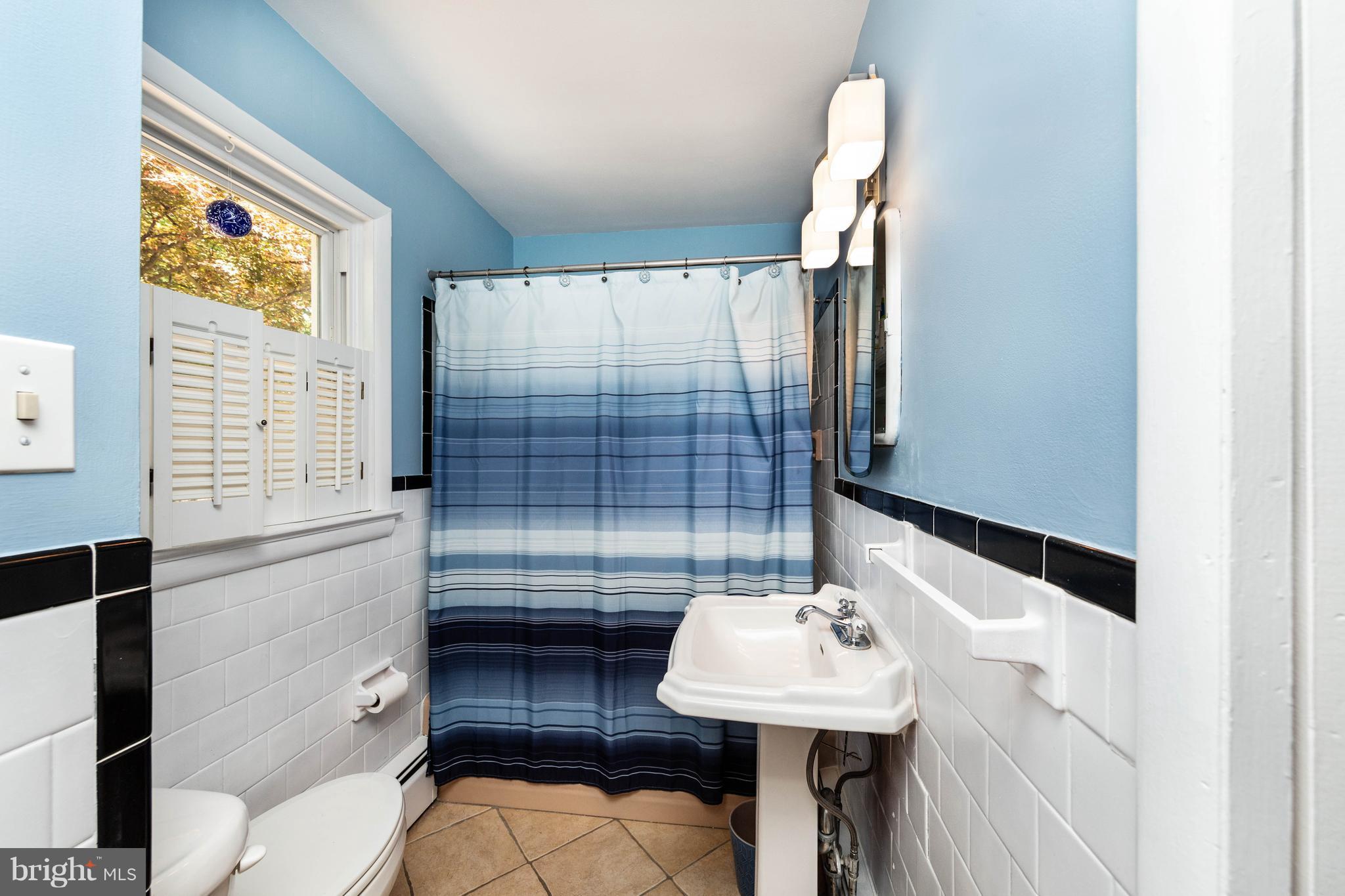 413 Whitaker Mill Road Fallston, MD 21047 - Photo 19 of 28 a bathroom with a sink toilet and shower