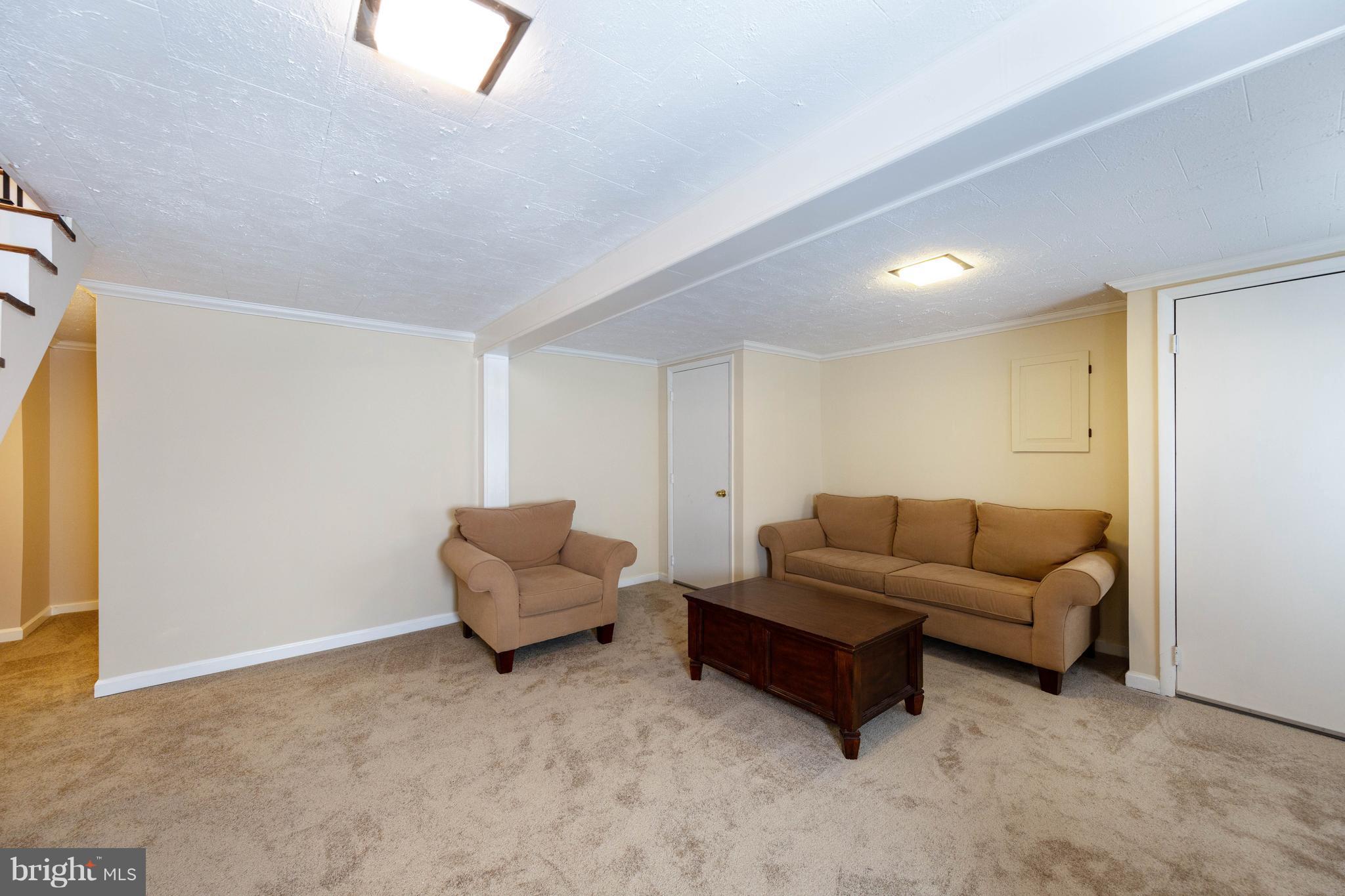 413 Whitaker Mill Road Fallston, MD 21047 - Photo 22 of 28 a living room with furniture and a couch