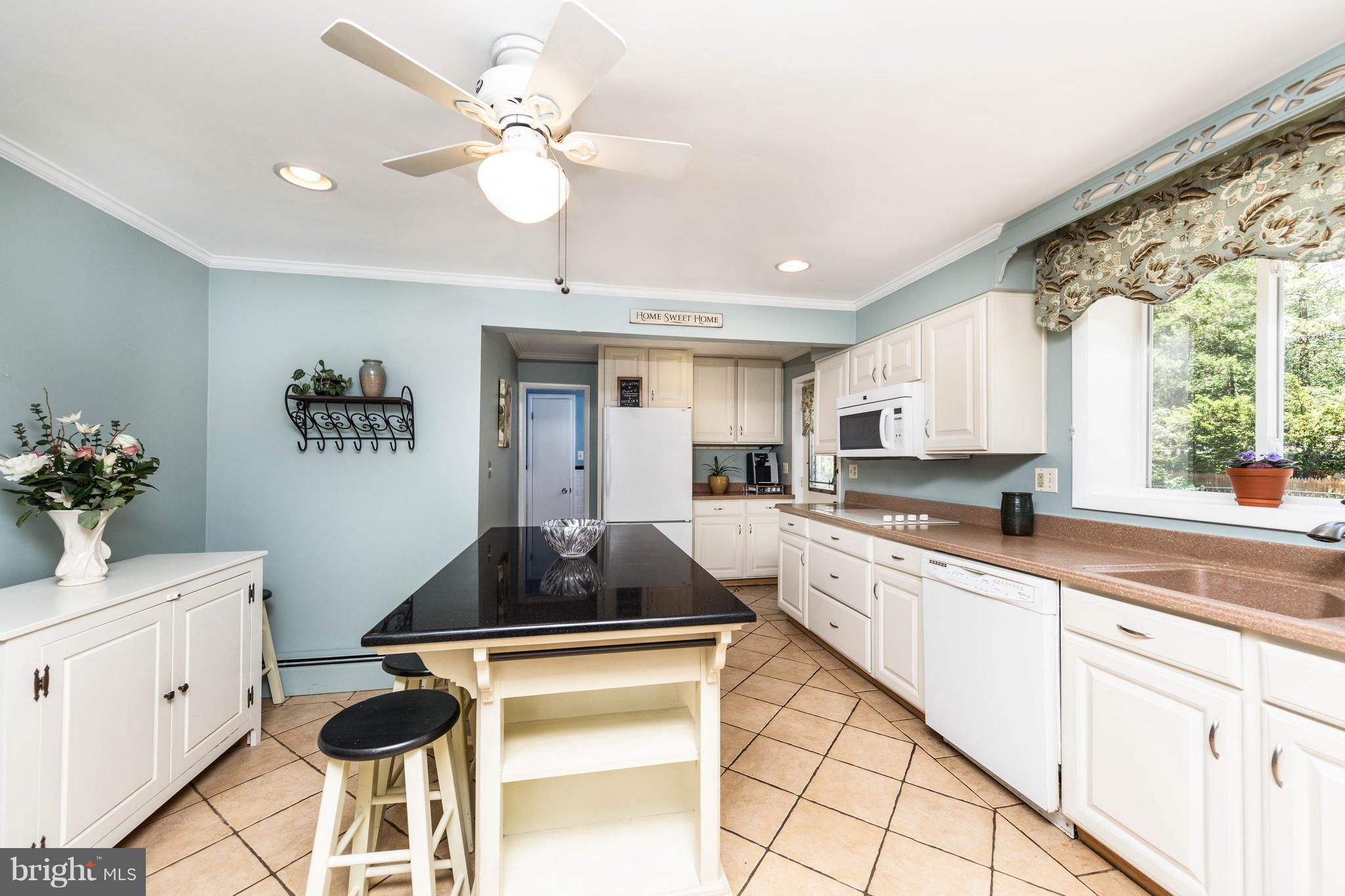 413 Whitaker Mill Road Fallston, MD 21047 - Photo 9 of 28 a kitchen with stainless steel appliances granite countertop a stove a sink and a refrigerator