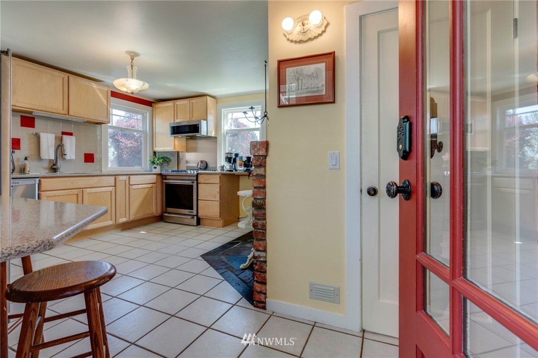 23908 24th Drive Southeast Bothell, WA 98021 - Photo 3 of 40 a kitchen with stainless steel appliances granite countertop a refrigerator and a stove top oven
