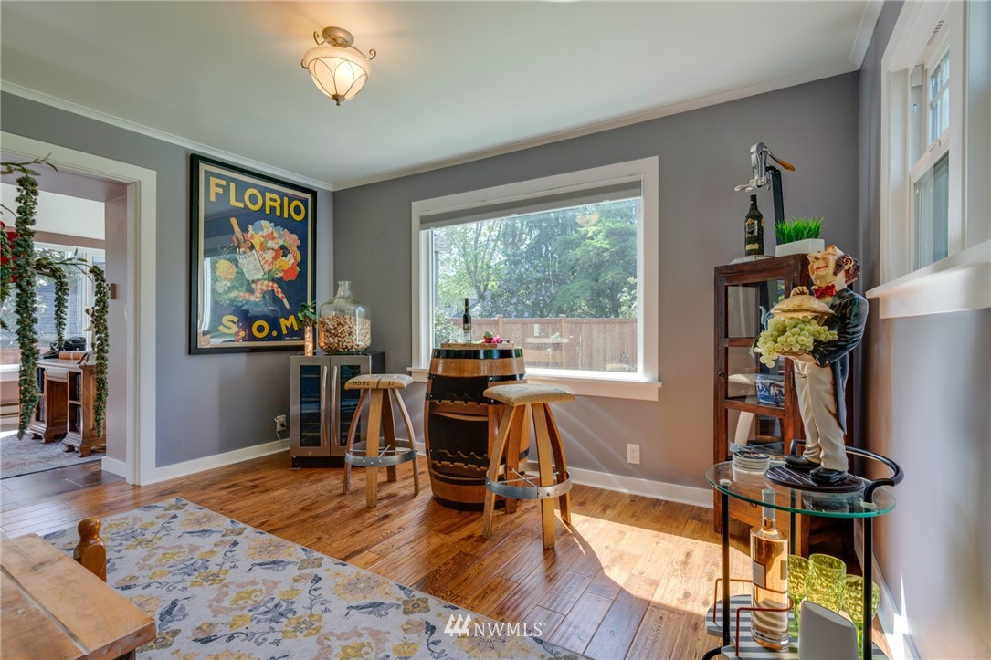 23908 24th Drive Southeast Bothell, WA 98021 - Photo 22 of 40 a view of a dining room with furniture a chandelier and wooden floor