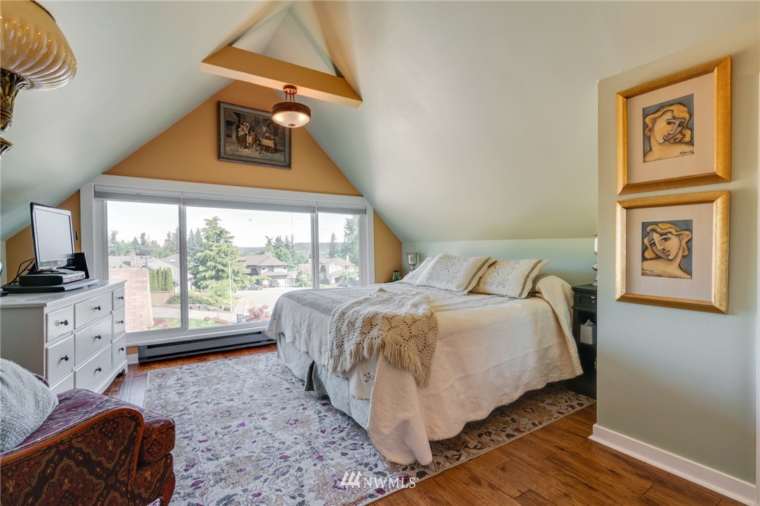 23908 24th Drive Southeast Bothell, WA 98021 - Photo 24 of 40 a bedroom with a bed and glass window