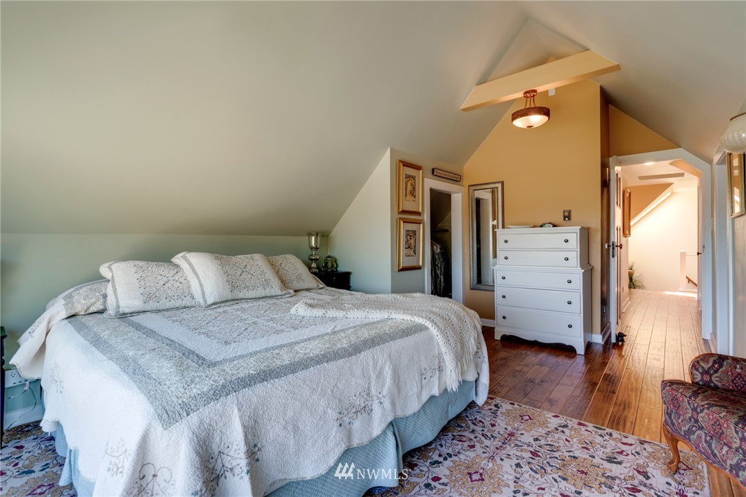 23908 24th Drive Southeast Bothell, WA 98021 - Photo 25 of 40 a bed room with a bed and wooden floor