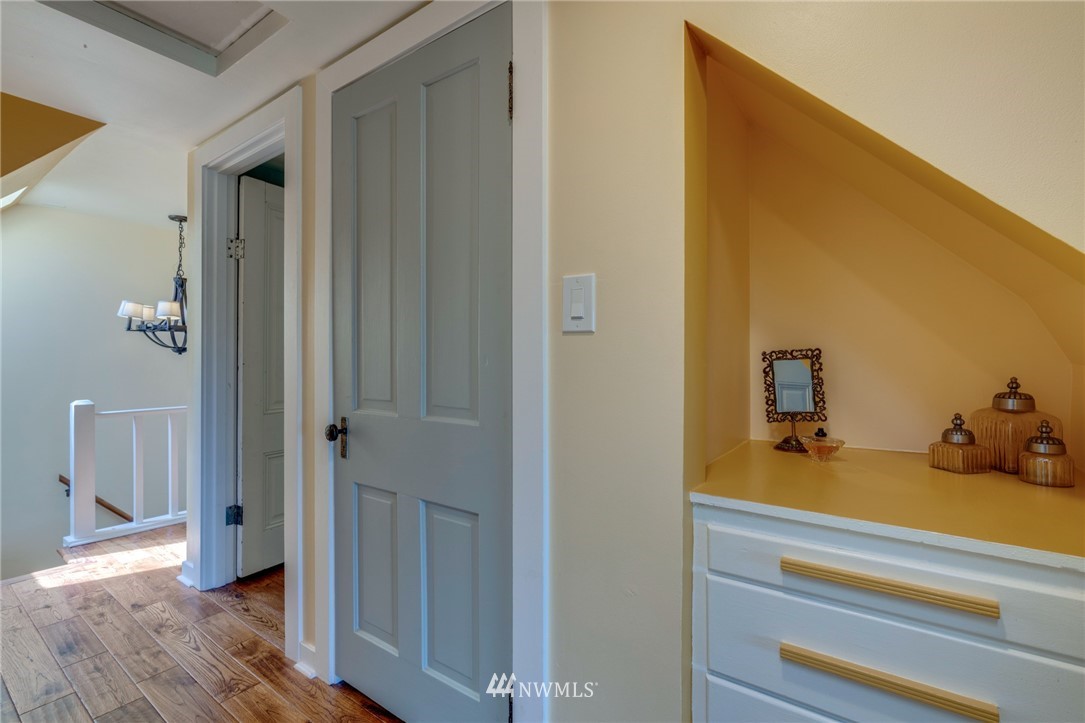 23908 24th Drive Southeast Bothell, WA 98021 - Photo 26 of 40 a bedroom with a bed and wooden floor