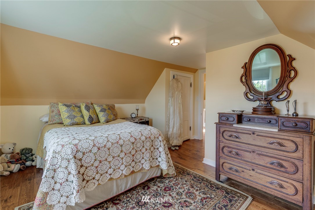 23908 24th Drive Southeast Bothell, WA 98021 - Photo 31 of 40 a bedroom with a bed and a mirror